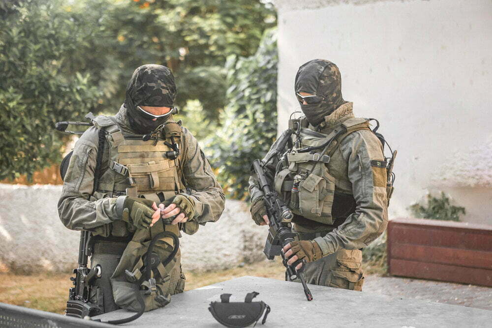 Two Soldiers With Vests In The Field